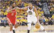  ?? Marcio Jose Sanchez, AP ?? Warriors forward Kevin Durant works against Rockets guard James Harden on Sunday.