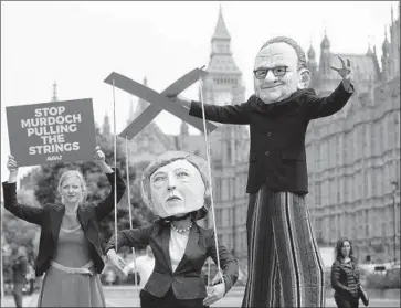  ?? Frank Augstein Associated Press ?? 21st CENTURY FOX can win British regulators’ approval for its $16-billion takeover of Sky by insulating the Sky News channel from the Murdoch family or selling it. Above, protesters of the deal in London in June.