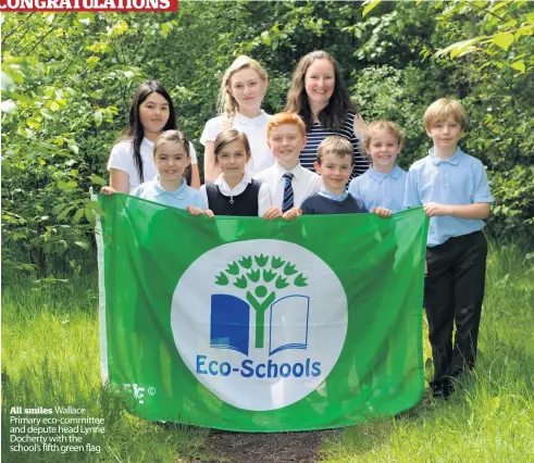  ??  ?? All smiles Wallace Primary eco-committee and depute head Lynne Docherty with the school’s fifth green flag