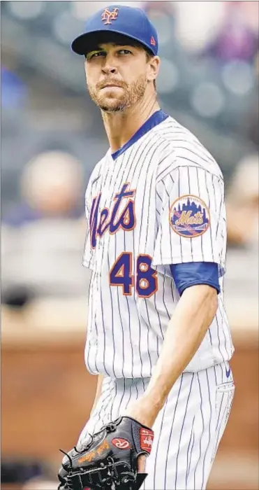  ?? AP ?? Jacob deGrom gives up one run and strikes out 14, but gets loss as Mets bats are silent against Marlins.
