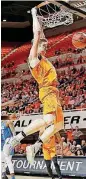  ?? [PHOTO BY BRYAN TERRY, THE OKLAHOMAN] ?? Oklahoma State’s Mitchell Solomon finishes off a dunk during Tuesday’s game against Florida Gulf Coast in Gallagher-Iba Arena