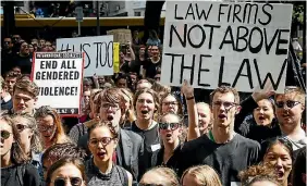  ?? PHOTO: ROSA WOODS/STUFF ?? Victoria University students protest outside Wellington law firm Russell McVeagh against sexual harassment in the law profession.