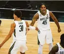  ?? JAY BIGGERSTAF­F/ USA TODAY SPORTS ?? Baylor guards Davion Mitchell and Macio Teague celebrate during the Big 12 Conference tournament game against Kansas State.