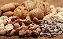  ??  ?? Getting enough magnesium in your diet, from foods such as nuts, could help achieve an optimal level of vitamin D.