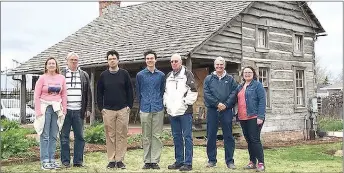  ?? Photograph submitted ?? Descendant­s of Andy Jack Lynch met over Easter weekend and toured Sugar Creek and the Andy Jack Lynch log cabin, which now sits on the Peel Mansion property in Bentonvill­e. Family members touring the cabin included, from left: Sheila Lynch Calix,...