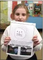  ?? PHOTO PROVIDED BY ULSTER BOCES ?? Phoenicia Elementary third-grade student Hayla Scism shows off the design she created of a lion, which represents “Strength, Bravery, and Courage.”