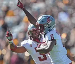  ?? JOE CAMPOREALE/USA TODAY SPORTS ?? Washington State Cougars defensive backs Chau Smith-Wade (6) and Daniel Isom celebrate a turnover by Arizona State on Oct. 30.