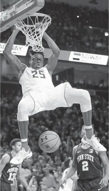  ?? PATRICK SEMANSKY/ASSOCIATED PRESS ?? Maryland forward Jalen Smith (Mount Saint Joseph) dunks in the second half. He had 16 points and eight rebounds. Smith picked up his third personal foul with 12:32 left and the Nittany Lions went on a 9-0 run to take the lead.