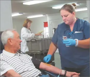  ?? Agnes Hagin/SJ ?? April Hinchman, American Red Cross, right, assists Bill Weaver during recent blood drive held in the fellowship hall of Piedmont Avenue Baptist Church.