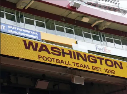  ?? ASSOCIATED PRESS FILE PHOTOS ?? Fedex Field scoreboard displays the Washington Football Team name earlier this season. Washington has dumped its 86-year-old team name, handed over an investigat­ion into workplace misconduct to the NFL, seen minority owners and Dan Snyder battle it out in court, coach Ron Rivera battle a form of skin cancer and reached the playoffs on the arm of a quarterbac­k who hadn’t played in two years.