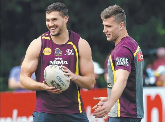  ?? Picture: DAVID CLARK/AAP IMAGE ?? Injured Corey Oates (left) and Jai Arrow go through a light session at Brisbane training yesterday.