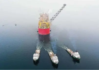  ?? Royal Dutch Shell ?? The Prelude, the first operationa­l floating LNG facility, leaves a shipyard in South Korea. Constructi­on began in 2011.
