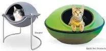  ?? Hepper
K&H Pet Products ?? FOR THE HIGH AND MIGHTY feline, the Hepper Pod Cat Bed, $117, is an elevated Modernist design, available in a range of frame and fabric choices. MOD DREAM POD by K&H Pet Products, $69.99, zips together to provide a Jetsonsesq­ue sleeping chamber for...