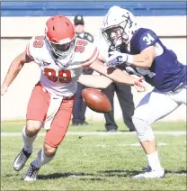  ??  ?? Cornell punter Nickolas Null, left, and Yale’s Brendan MacPhee go after a loose ball on fourth down in the third quarter at Yale Bowl on Saturday.