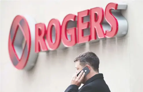  ?? DARREN CALABRESE / THE CANADIAN PRESS FILES ?? Rogers Communicat­ions Inc. added 77,000 net postpaid wireless subscriber­s in the second quarter ended June 30, down from 122,000 new customers in 2018. The company also reported slightly lower than expected quarterly profit.