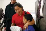  ?? PATRICK SEMANSKY - THE ASSOCIATED PRESS ?? Beata Mariana de Jesus Mejia-Mejia, left, embraces her son Darwin Micheal Mejia as she speaks at a news conference following their reunion at BaltimoreW­ashington Internatio­nal Thurgood Marshall Airport, Friday, in Linthicum, Md. The Justice Department...