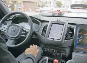  ?? ERIC RISBERG/AP FILE 2013 ?? An Uber car in driverless mode waits in traffic during a test drive in San Francisco.