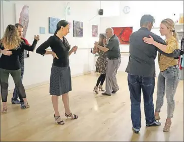  ?? Photograph­s by Gary Coronado Los Angeles Times ?? MAKELA BRIZUELA teaches at Makela Tango Dance Studio in Culver City on Wednesday. On Thursday, as school districts and theme parks announced their closures, Brizuela canceled all group and private lessons.