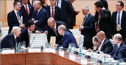  ?? Picture: EPA ?? CROSSROADS: US President Donald Trump, left, chats to Turkish President Recep Tayyip Erdogan, fourth left, and Turkish Foreign Minister Mevlut Cavusoglu, third left, as Russian President Vladimir Putin, right, and President Jacob Zuma, second right,...