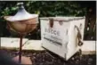  ?? COLIN CONCES — SUN VALLEY LANDSCAPIN­G VIA AP ?? This photo provided by Sun Valley Landscapin­g shows a bocce game kit at a backyard party in Omaha, Neb. The home features a decomposed granite chip bocce court with reclaimed cedar side boards.