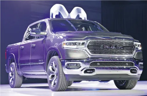  ?? DANIEL ACKER / BLOOMBERG ?? Fiat Chrysler’s 2019 Dodge Ram 1500 Limited pickup truck makes its debut Monday at the Detroit auto show. FCA and GM are making their trucks lighter to improve fuel efficiency, following Ford’s lead in using more aluminum.