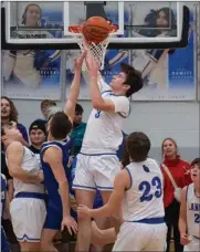  ?? PHOTO PROVIDED ?? Lucas Plummer snags a rebound during a game last year. The senior is one of the key returnees to the Laville lineup this season.