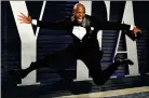  ??  ?? „ Actor Terry Crews jumps for joy.