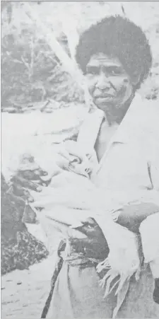  ?? Picture: FILE ?? Lucky to be alive ... Serafina Sekirewa holds her 3-yearold son Asela Waqaniono after Cyclone Meli wreaked havoc and claimed lives in their village of Vabea, Kadavu in 1979.