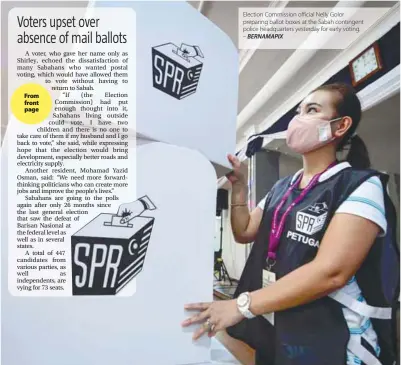  ?? – BERNAMAPIX ?? Election Commission official Nelly Golor preparing ballot boxes at the Sabah contingent police headquarte­rs yesterday for early voting.