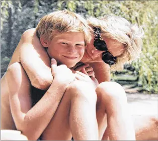  ?? AP PHOTO ?? In this photo made available by Kensington Palace from the personal photo album of the late Diana, Princess of Wales, shows the princess and Prince Harry on holiday, and features in the new ITV documentar­y ‘Diana, Our Mother: Her Life and Legacy.’...