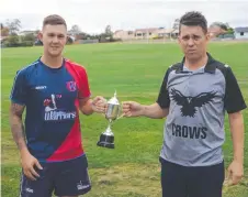  ??  ?? UP FOR GRABS: Wellington's Nathan Muir (left) and St Annes’ Sean McGuire with the SCA premiershi­p trophy.