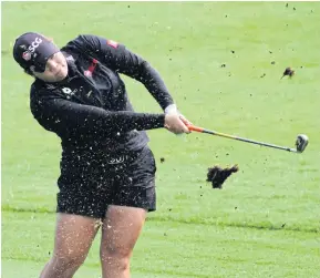  ??  ?? Ariya Jutanugarn hits a shot in the third round.