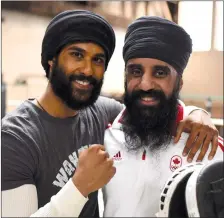  ??  ?? Prem Singh, left, and Pardeep Singh Nagra are seen on the set of the film “Tiger” in this undated handout photo. With a new film coming out about his fight inside and outside the ring as a Sikh boxer in Ontario, Pardeep Singh Nagra says the issues he faced almost two decades ago are still plaguing the sport.