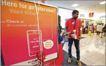  ?? TY GREENLEES / STAFF ?? Kohl’s store manager Brandy Duran (left) helps new hire Cortland Williams locate products at the Centervill­e store. Retailers around the area are trying to lock down seasonal employees amid 4 percent area unemployme­nt.