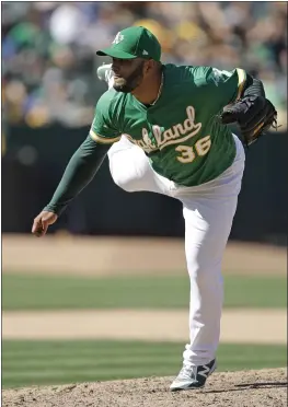  ?? BEN MARGOT – THE ASSOCIATED PRESS ?? A’s relief pitcher Yusmeiro Petit pitched a scoreless ninth inning to close out Saturday’s game against Houston. The A’s won 8-4to get within 61⁄2 games of the Astros.