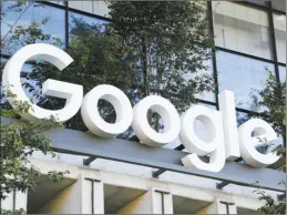  ?? AP photo ?? The Google sign is shown over an entrance to the company’s new building in New York on Sept. 6. If government regulators prevail in the biggest U.S. antitrust trial in a quarter century, it’s likely to unleash drastic changes designed to underminin­g the dominance of the Google search engine that defines the internet for billions of people.