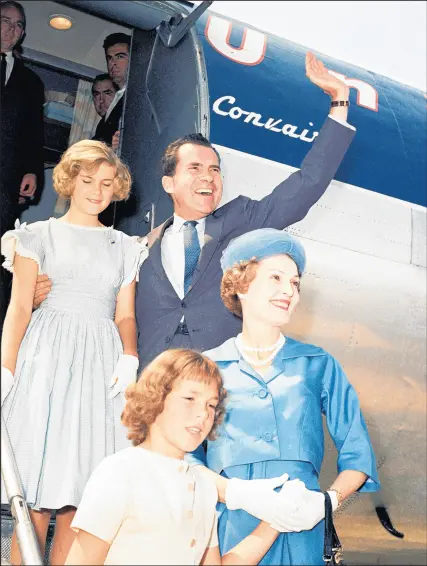  ?? AP ?? Vice President Richard Nixon and family wave while arriving July 25, 1960, in Chicago for the Republican Convention. Nixon is accompanie­d by his wife, Pat, and their daughters, Julie and Patricia.