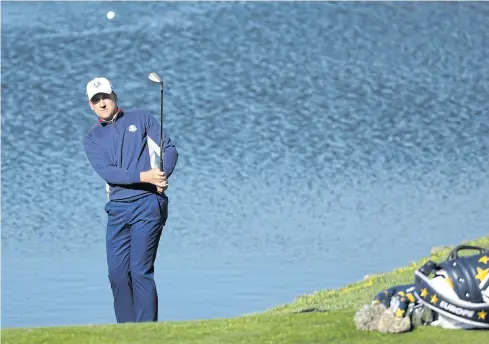  ?? AP ?? Europe’s Ian Poulter plays a shot during a practice round at Le Golf National yesterday.