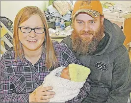  ?? Darrell Cole/ TC Media ?? Nicole Anderson and Jeffrey Hicks and their newborn James will certainly have a story to share about his arrival into the world. Anderson went into labour at the height of Monday’s blizzard and was taken by ambulance to hospital in Amherst where she...