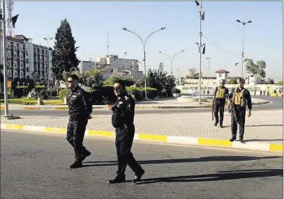  ?? Emad Matti ?? Local police are deployed in Kirkuk, Iraq, on Monday. Kurdish officials said early Monday that federal forces and state-backed militias had launched a “major, multi-pronged” attack to retake the disputed northern city.