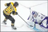  ?? The Associated Press ?? Michael Dwyer
Bruins right wing David Pastrnak takes a shot against Lightning goalie Andrei Vasilevski­y during the third period of Boston’s win Saturday at TD Garden.