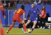  ?? SAM HODDE — GETTY IMAGES ?? The United States’ Olivia Moultrie controls the ball as China’s Shen Mengyu defends during the second half at Toyota Stadium on Dec. 5, in Frisco, Texas.