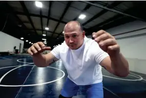  ?? JOE RONDONE/THE COMMERCIAL APPEAL ?? Owner and head wrestling coach Tyler Knox at Conxion in Hernando, seen here on March 31. Knox and his team are opening the gym to help train wrestlers in Desoto County after an inaugural season last year, in a state that held sanctioned high school wrestling for the first time in decades.