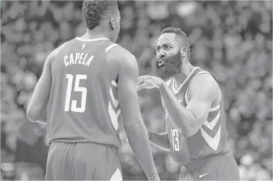  ?? Michael Ciaglo / Houston Chronicle ?? Rockets star James Harden, right, has a few words of advice for center Clint Capela during a break in the action in a game last month against the Mavericks.