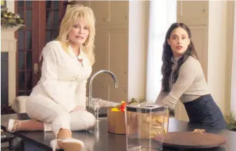  ?? Photo / Netflix ?? Dolly Parton, left, and Jeanine Mason in a scene from Dolly Parton’s Christmas on the Square.