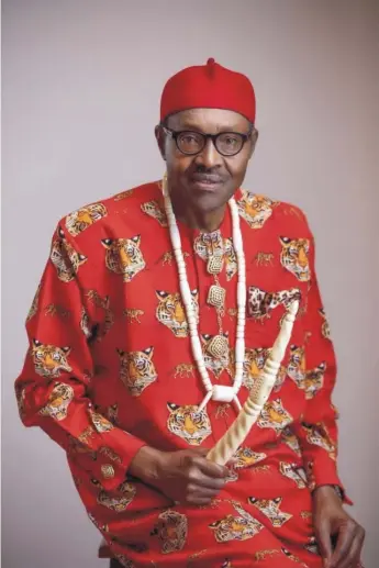  ??  ?? Nigerian President Muhammadu Buhari in traditiona­l Igbo attire