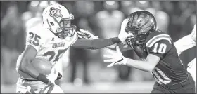  ?? NWA Democrat-Gazette/BEN GOFF • @NWABENGOFF ?? Arkadelphi­a’s Dillion Scott (25) stiff-arms Pea Ridge defensive back Carson Rhine on Friday during the 4A state semifinal game at Blackhawk Stadium in Pea Ridge.