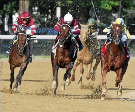  ?? PHOTO ARIANNA SPDONI/NYRA ?? Tenfold, center, races to the front of the field to capture the 2018 G1 Jim Dandy Stakes at Saratoga Race Course.