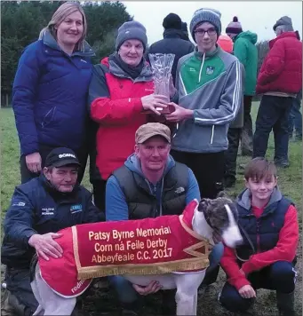  ??  ?? The Nolan family of Trish, Mary, Mark,Tom and Jack with the Corn na Feile Derby trophy after the victory of Silent Whisper at Abbeyfeale. Bottom left is Moss Leen. Photo by Moss Joe Browne