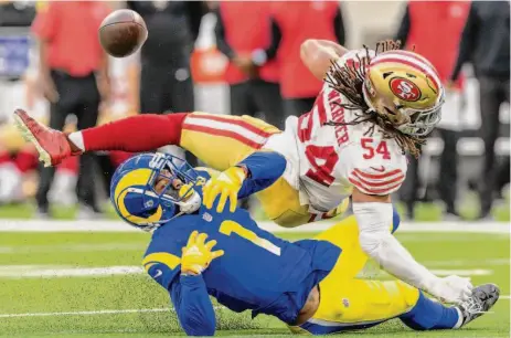  ?? Jeff Lewis / Associated Press ?? San Francisco linebacker Fred Warner breaks up a pass intended for Rams wide receiver Allen Robinson earlier this season.